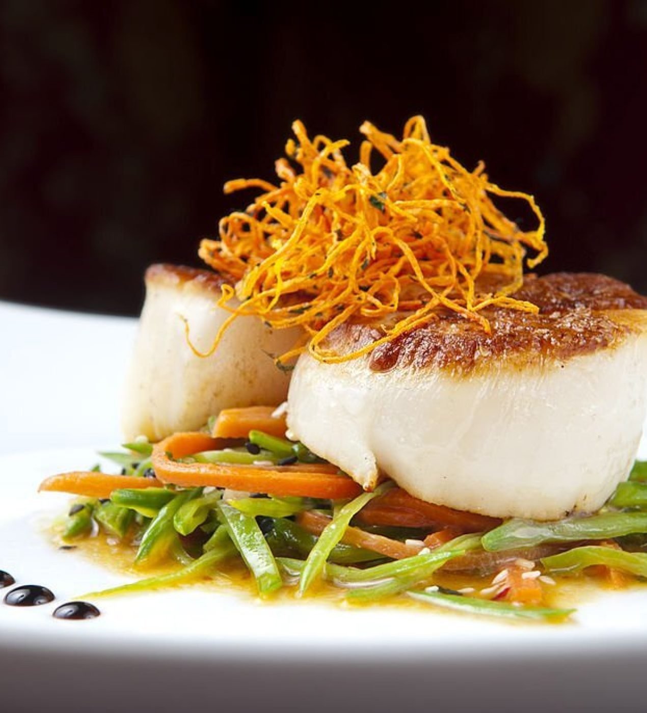 Seared Scallops on a bed of vegetables